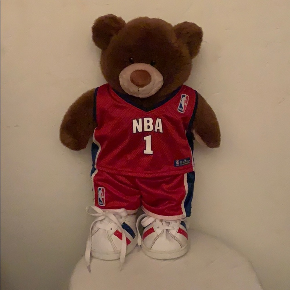 A brown Build a bear dressed as a basketball star